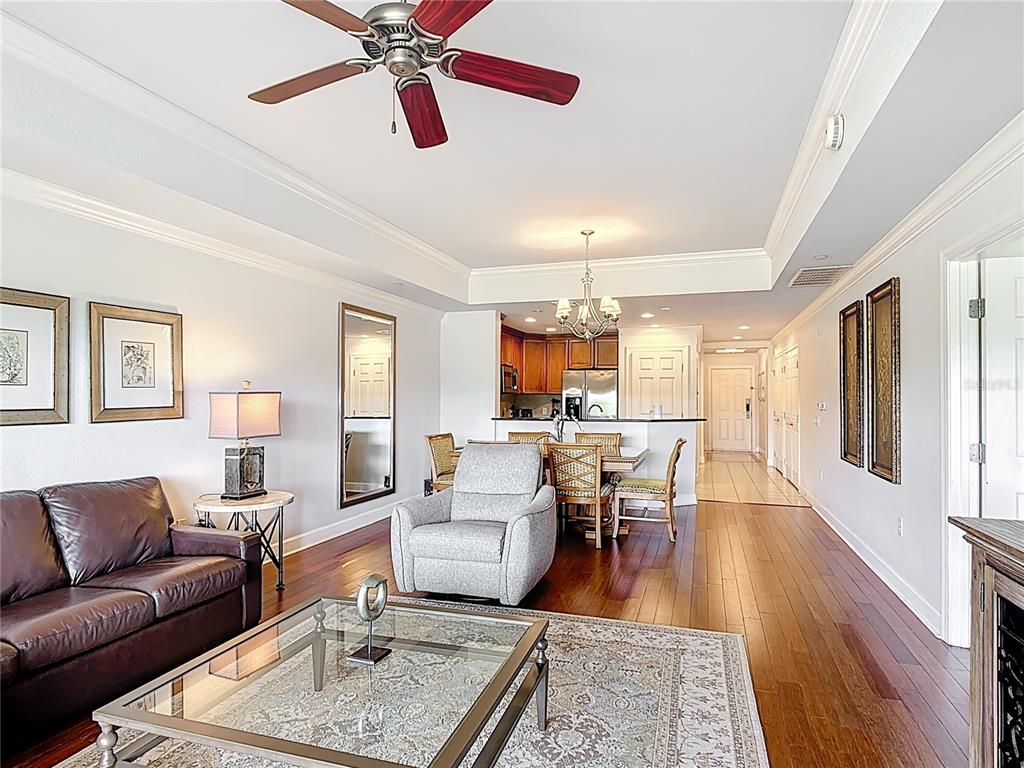 1356 Centre Ct Ridge Drive, Unit 103 Reunion, FL 34747 - Photo 18 of 53 a living room with furniture and a wooden floor