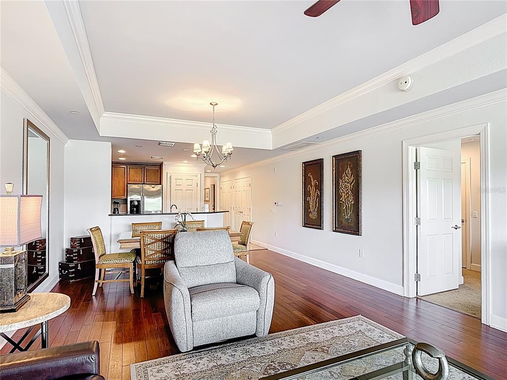 1356 Centre Ct Ridge Drive, Unit 103 Reunion, FL 34747 - Photo 19 of 53 a living room with furniture and wooden floor