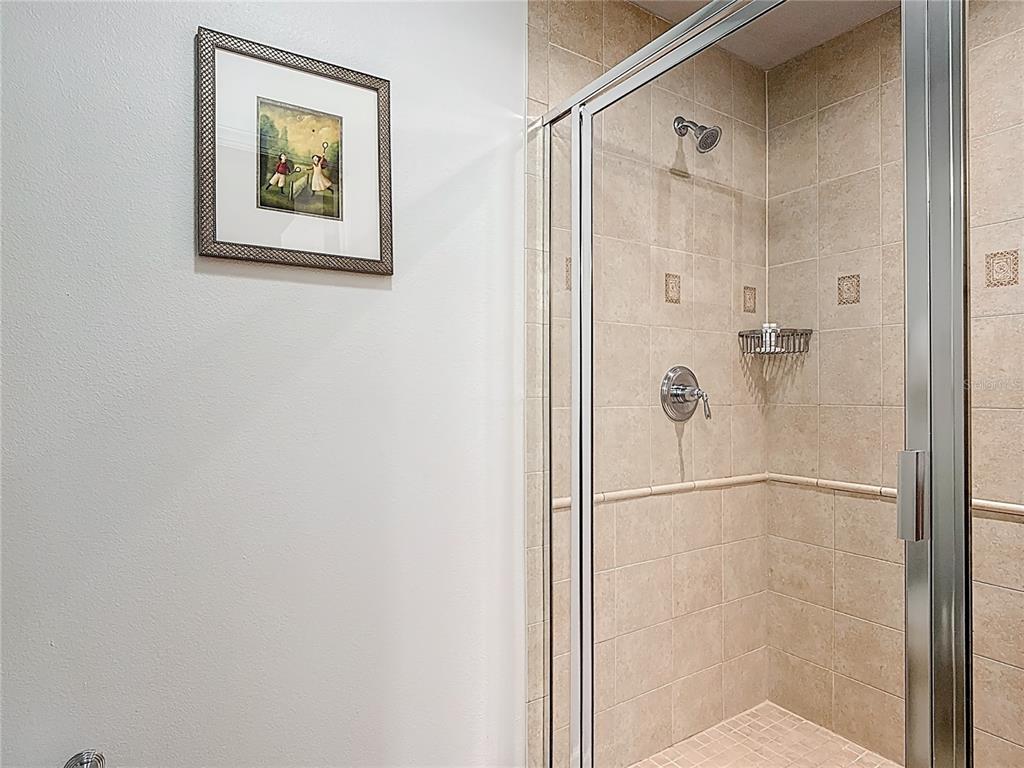 1356 Centre Ct Ridge Drive, Unit 103 Reunion, FL 34747 - Photo 30 of 53 a bathroom with a shower