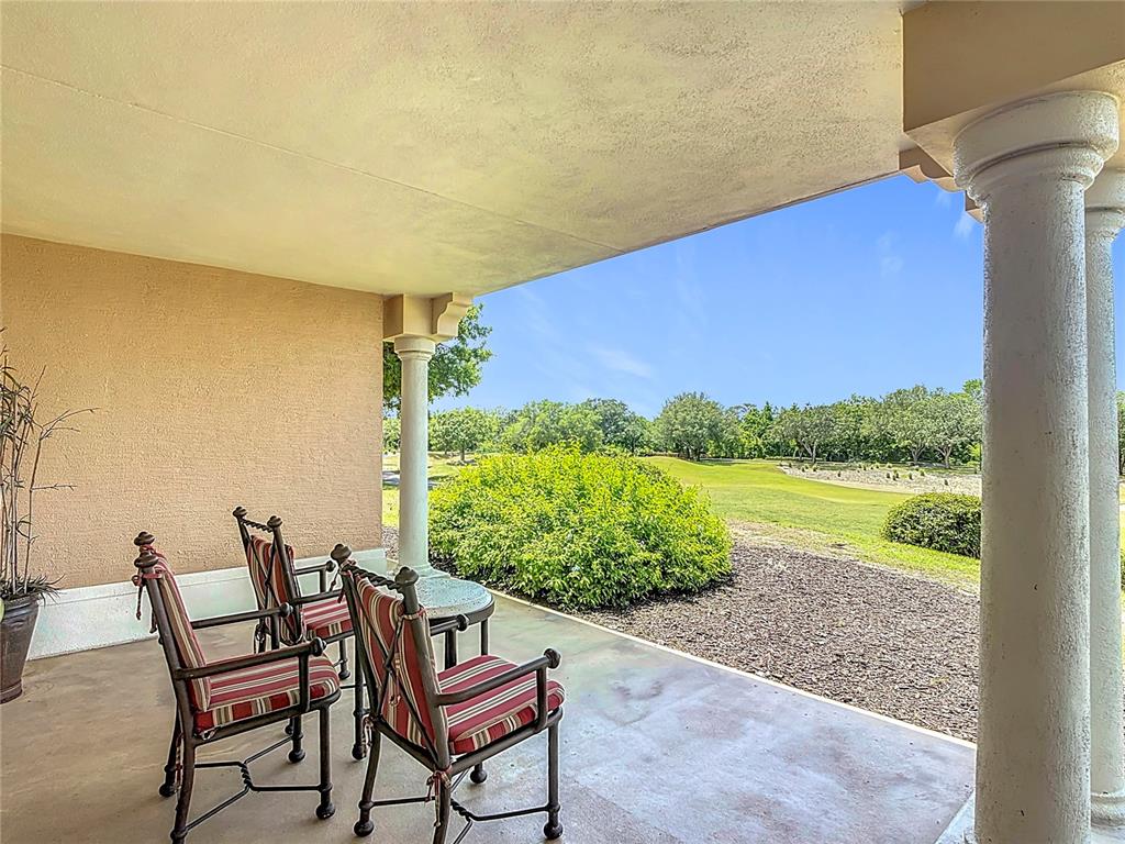 1356 Centre Ct Ridge Drive, Unit 103 Reunion, FL 34747 - Photo 40 of 53 a view of a chairs and table in the patio
