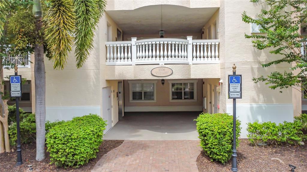 1356 Centre Ct Ridge Drive, Unit 103 Reunion, FL 34747 - Photo 4 of 53 a front view of a house with garden