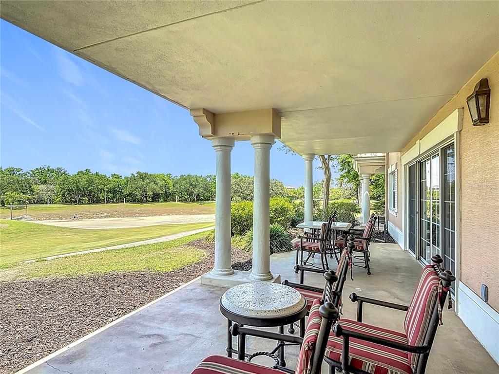 1356 Centre Ct Ridge Drive, Unit 103 Reunion, FL 34747 - Photo 41 of 53 a view of a dining room with furniture window and outside view