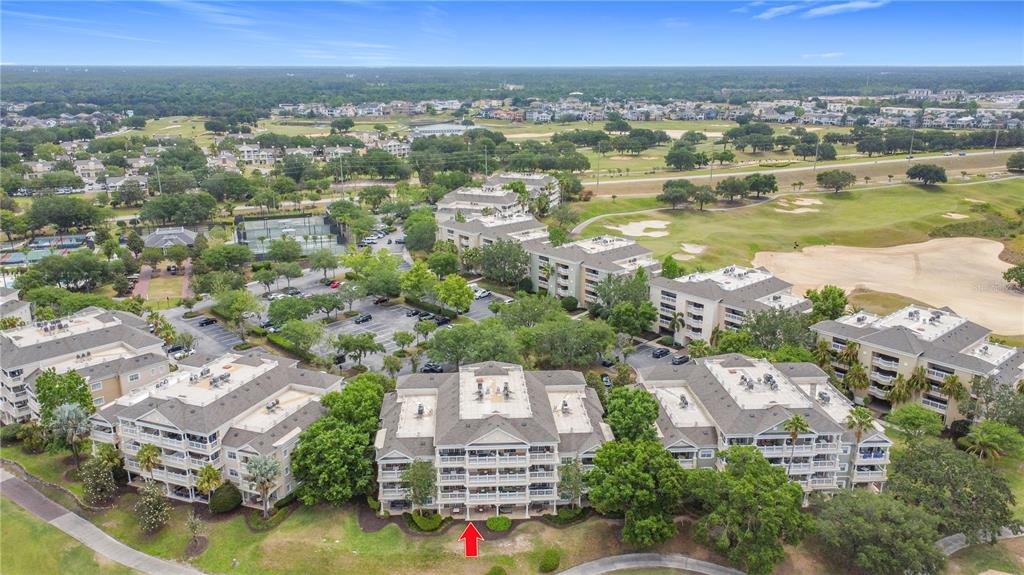 1356 Centre Ct Ridge Drive, Unit 103 Reunion, FL 34747 - Photo 45 of 53 an aerial view of residential building with outdoor space