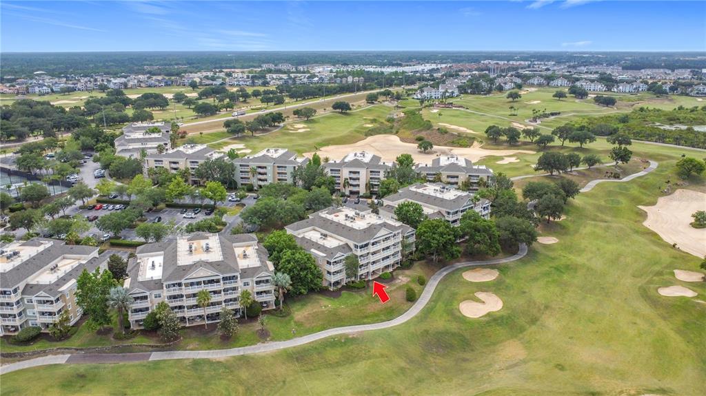 1356 Centre Ct Ridge Drive, Unit 103 Reunion, FL 34747 - Photo 46 of 53 a view of a city with lots of residential buildings ocean and mountain view in back