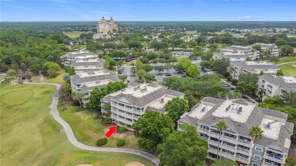 1356 Centre Ct Ridge Drive, Unit 103 Reunion, FL 34747 - Photo 48 of 53 an aerial view of residential houses with outdoor space and trees