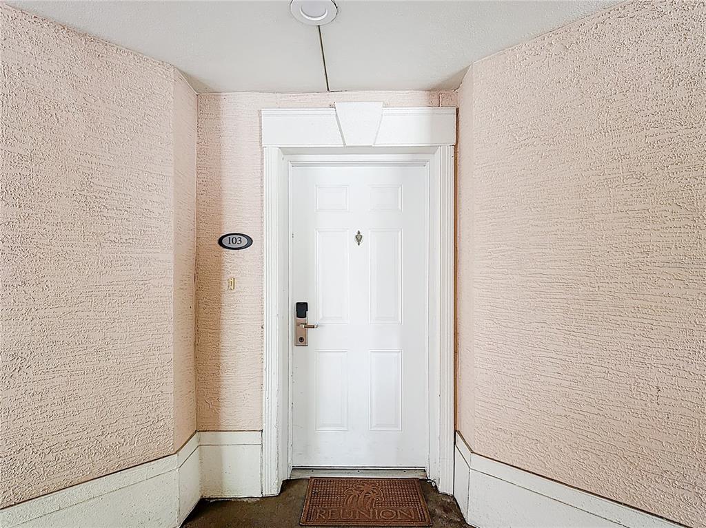 1356 Centre Ct Ridge Drive, Unit 103 Reunion, FL 34747 - Photo 5 of 53 a view of a hallway with a elevator