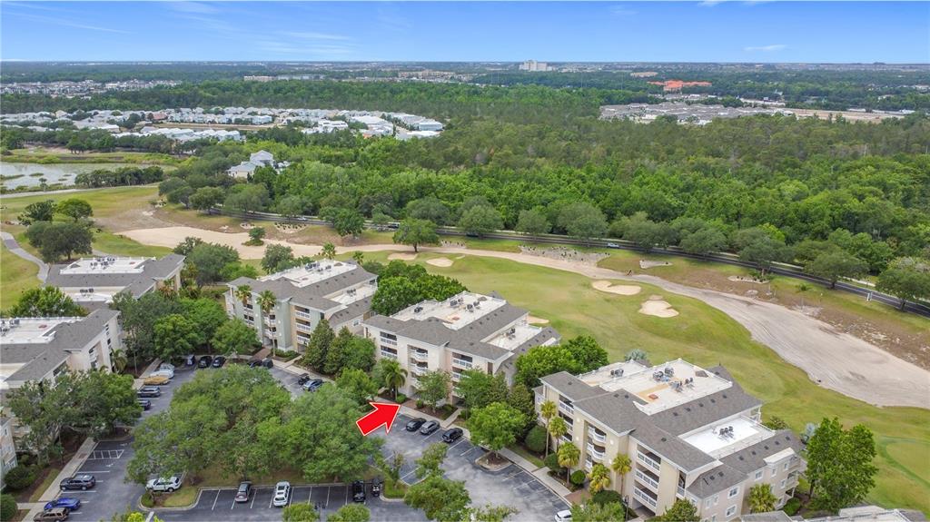 1356 Centre Ct Ridge Drive, Unit 103 Reunion, FL 34747 - Photo 52 of 53 an aerial view of residential houses with outdoor space and river