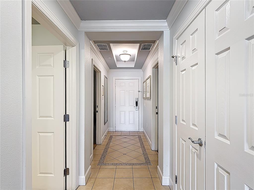 1356 Centre Ct Ridge Drive, Unit 103 Reunion, FL 34747 - Photo 6 of 53 a view of a hallway with wooden shelves