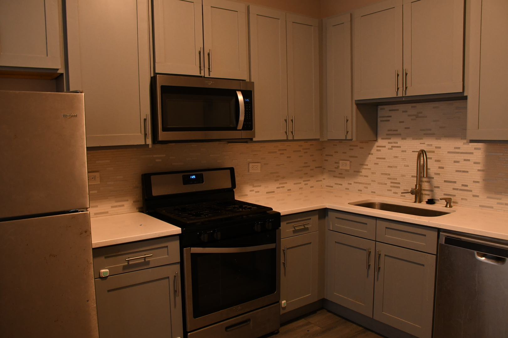6522 South Ellis Avenue, Unit 1 Chicago, IL 60637 - Photo 3 of 5 a kitchen with a sink and a microwave