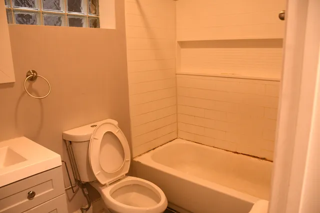 a bathroom with a toilet and a sink