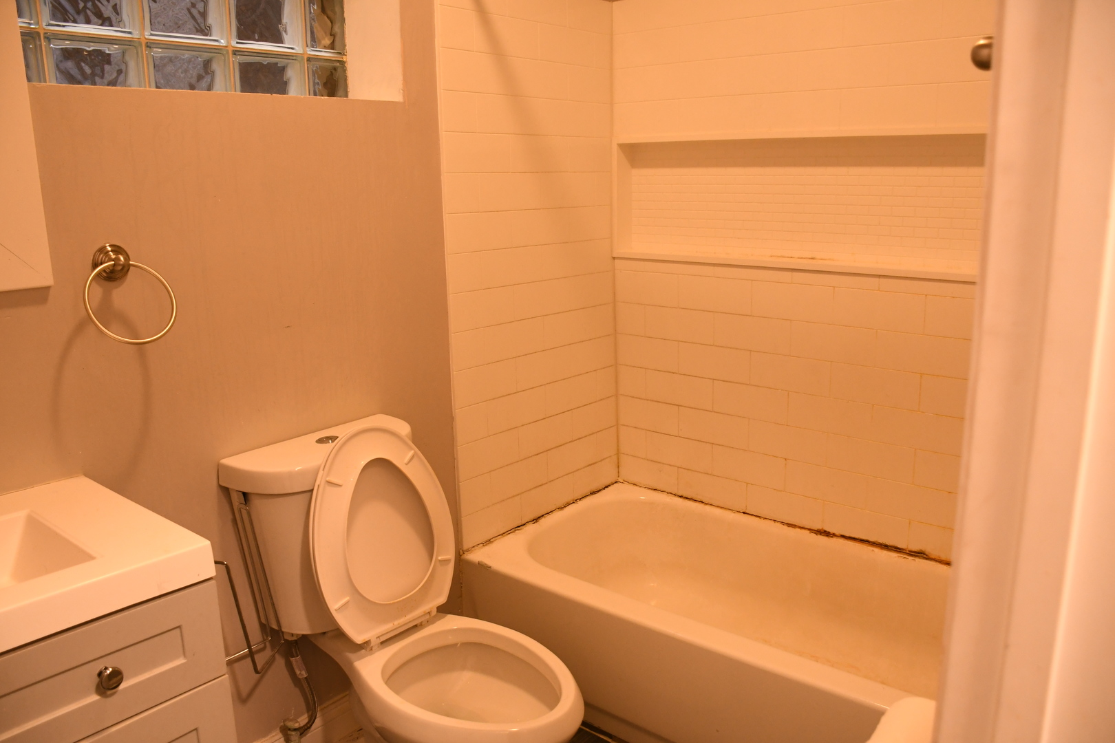 6522 South Ellis Avenue, Unit 1 Chicago, IL 60637 - Photo 4 of 5 a bathroom with a toilet and a sink