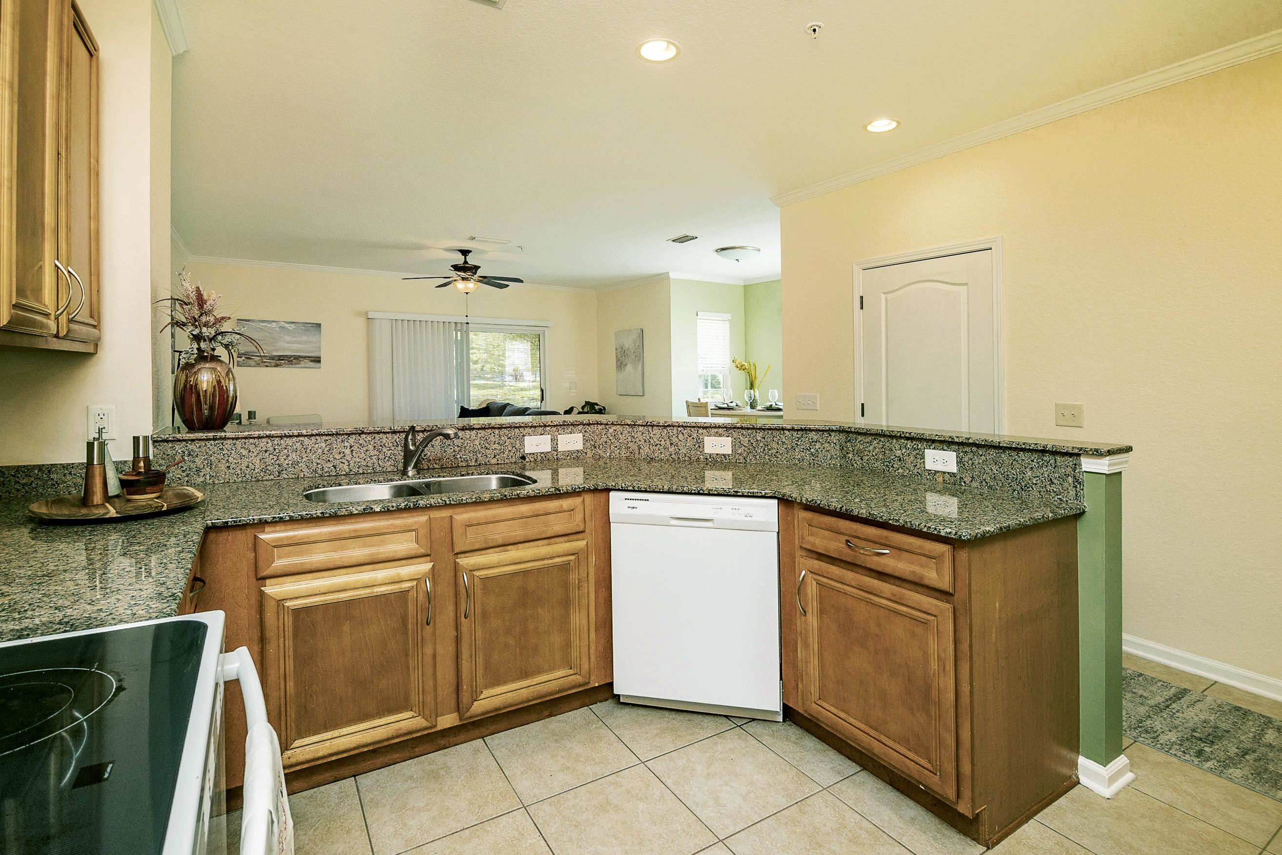 175 Bayberry Circle, Unit 1008 St. Augustine, FL 32086 - Photo 13 of 44 a kitchen with stainless steel appliances granite countertop a sink and cabinets