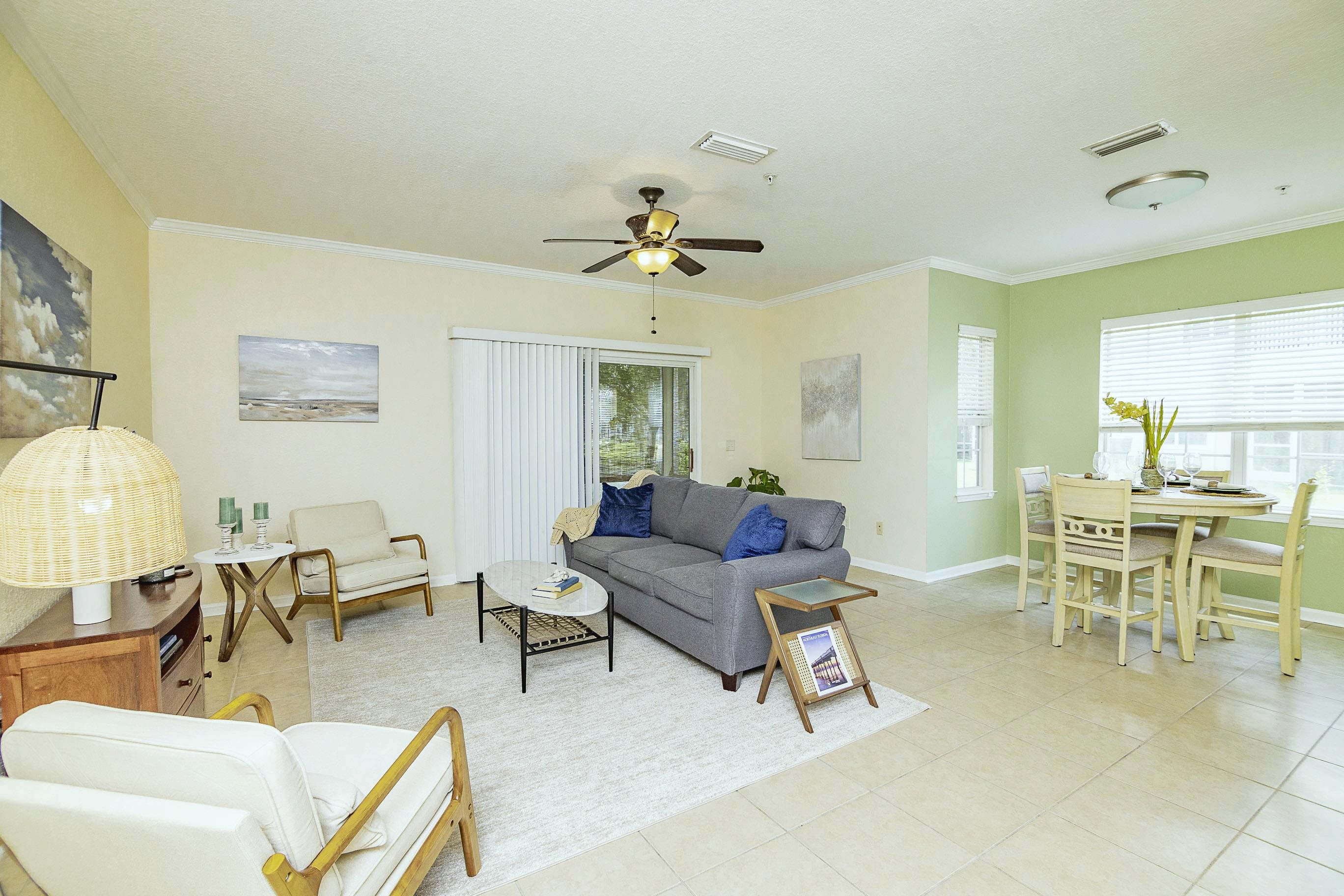 175 Bayberry Circle, Unit 1008 St. Augustine, FL 32086 - Photo 15 of 44 a living room with furniture and a chandelier