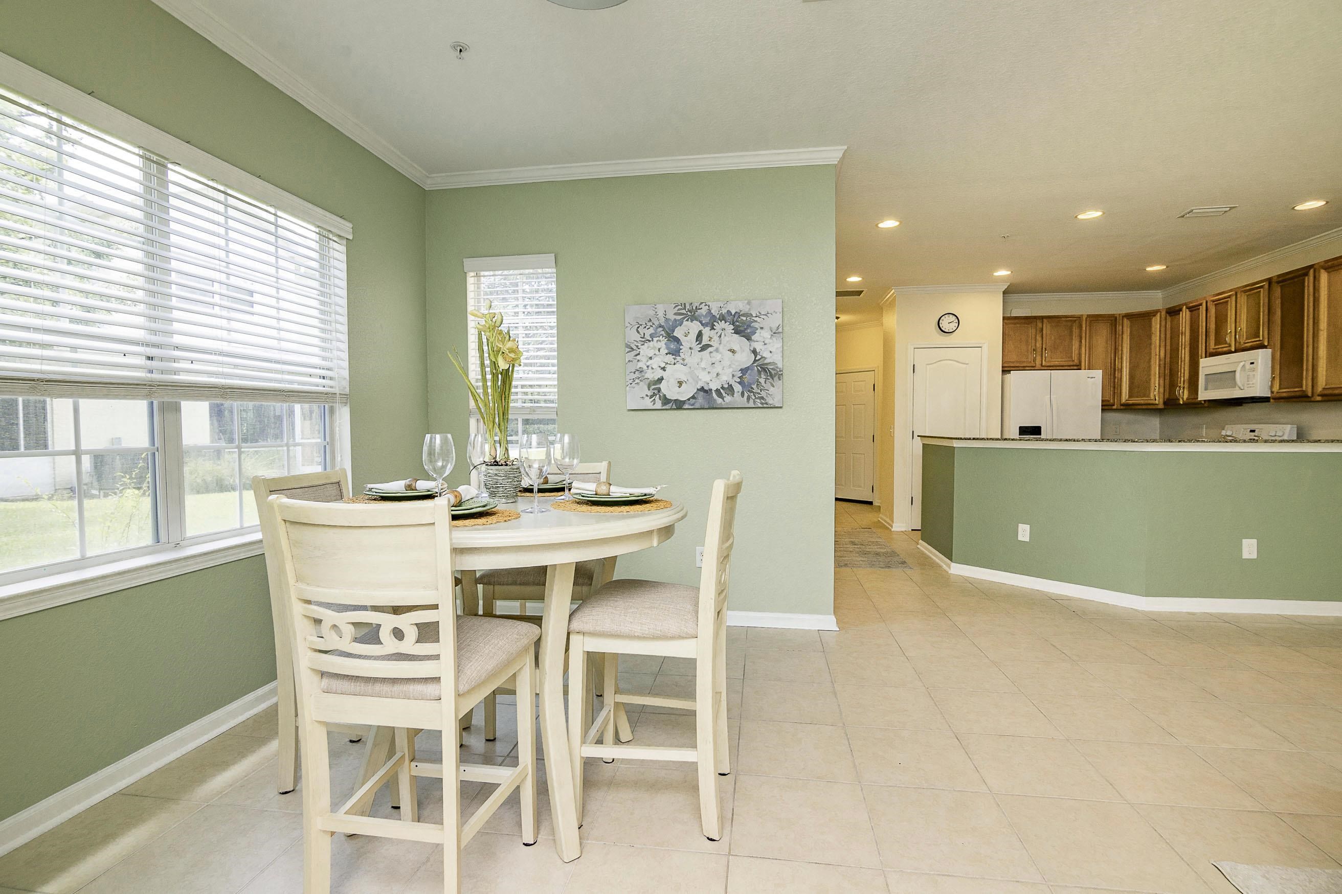 175 Bayberry Circle, Unit 1008 St. Augustine, FL 32086 - Photo 18 of 44 a view of a dining room with furniture and window