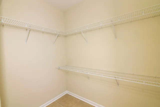 a view of a room with shelf on the wall