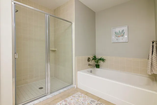 a bathroom with a bathtub and a shower