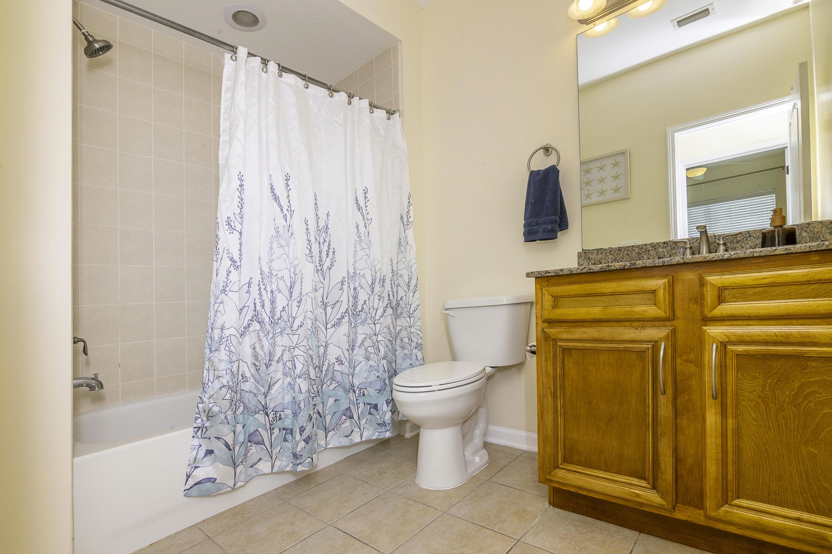 175 Bayberry Circle, Unit 1008 St. Augustine, FL 32086 - Photo 33 of 44 a bathroom with a toilet sink and shower