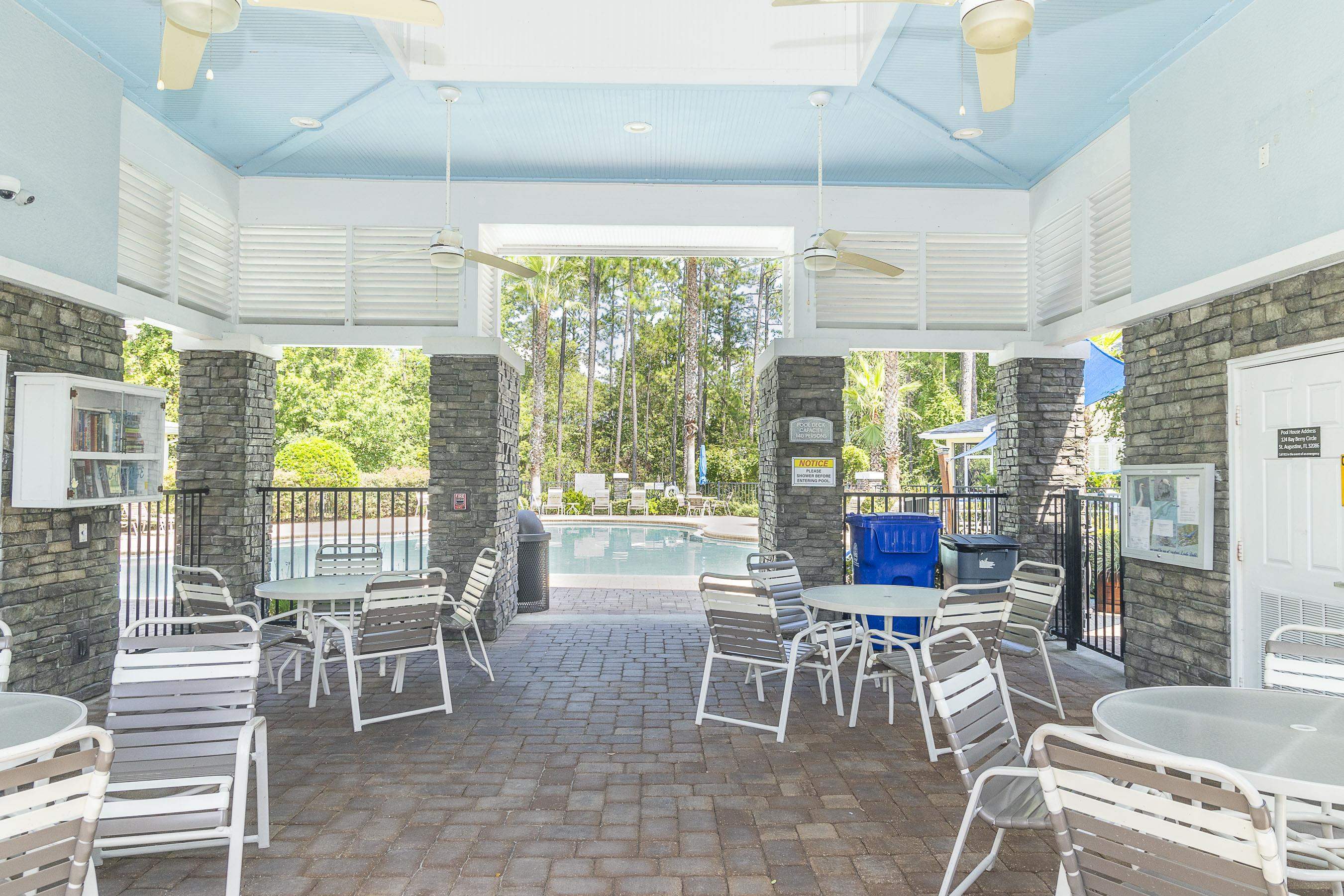 175 Bayberry Circle, Unit 1008 St. Augustine, FL 32086 - Photo 44 of 44 a dining room with furniture a chandelier and outdoor view