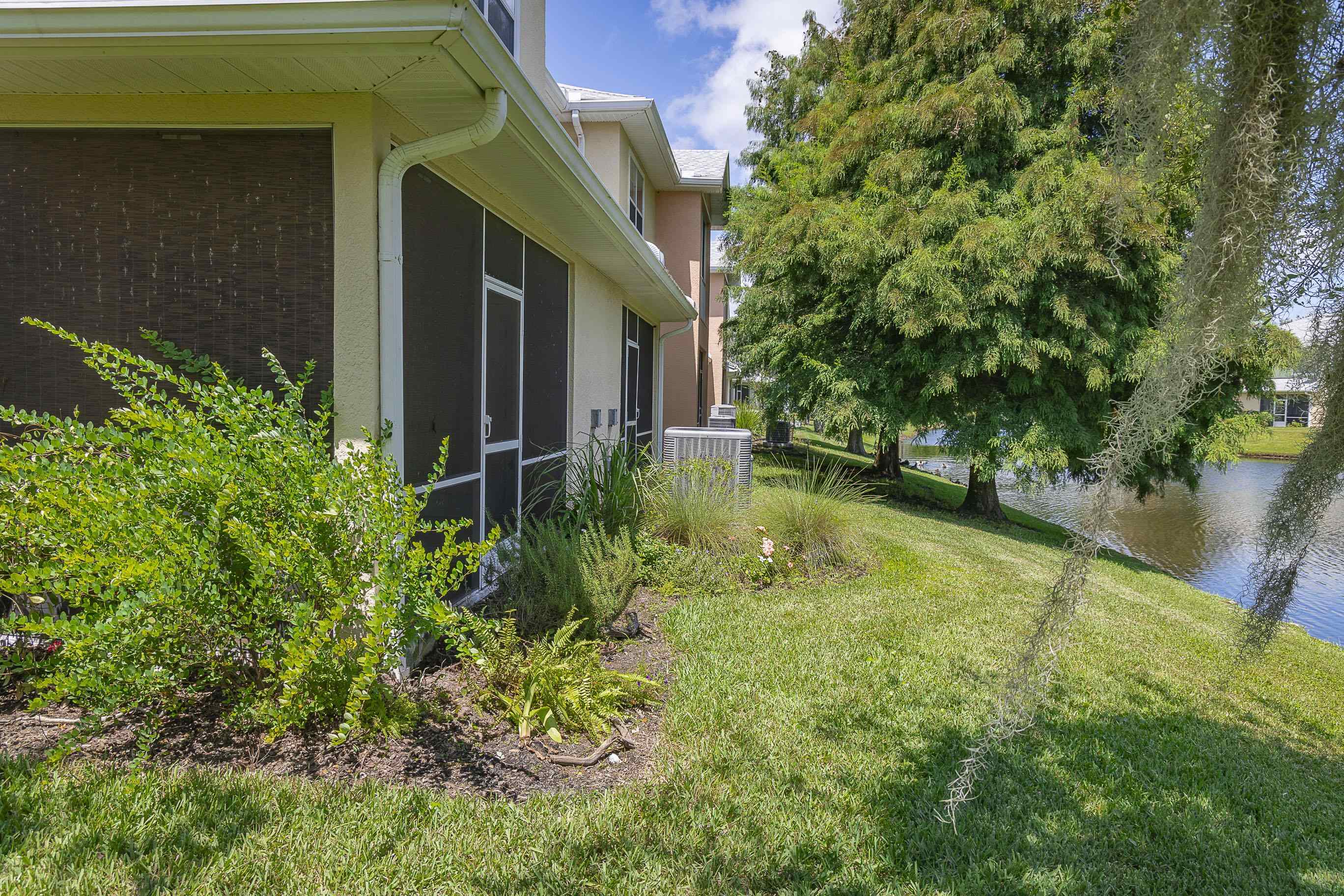 175 Bayberry Circle, Unit 1008 St. Augustine, FL 32086 - Photo 5 of 44 a view of a backyard with plants