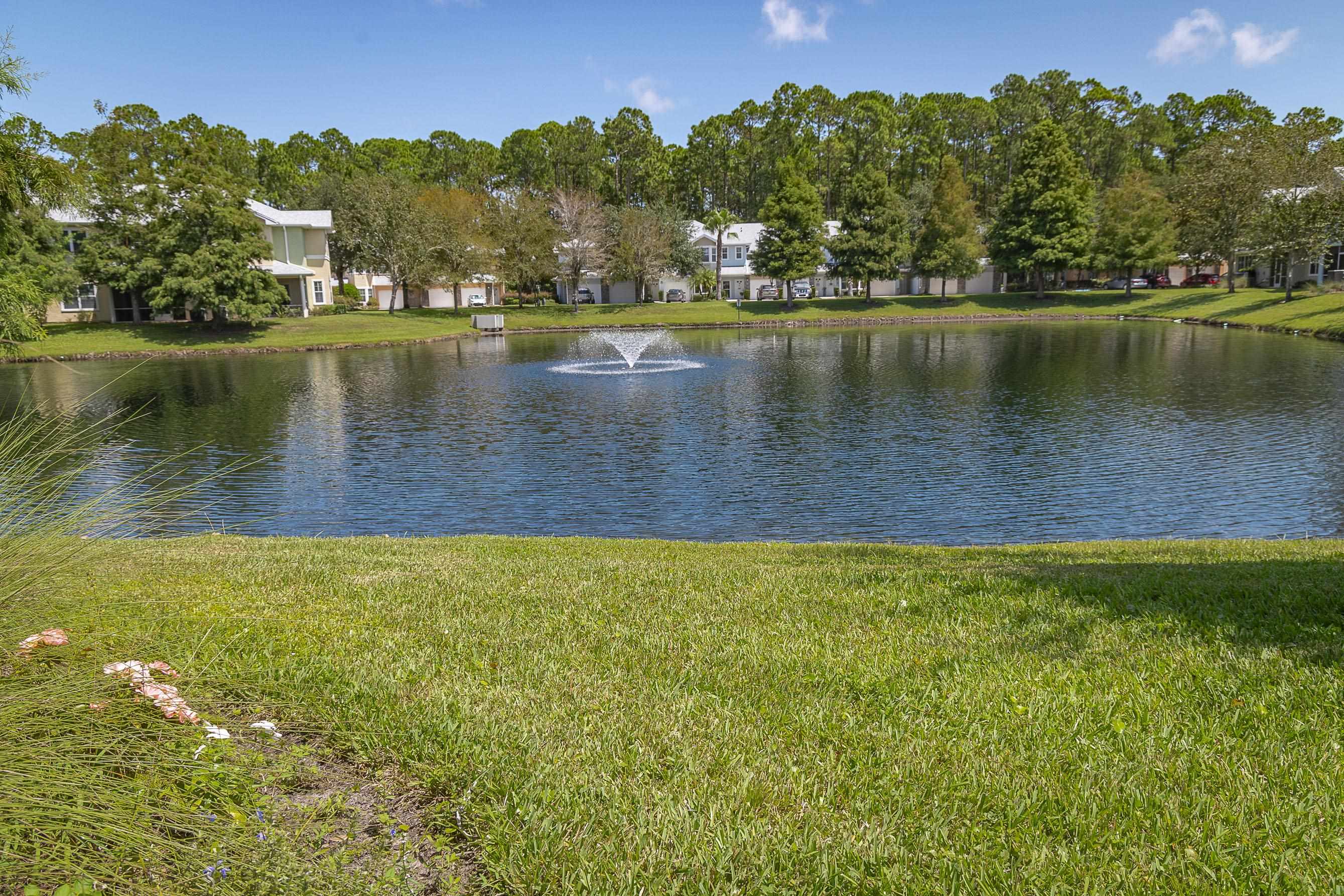 175 Bayberry Circle, Unit 1008 St. Augustine, FL 32086 - Photo 6 of 44 a view of a lake with houses in the back