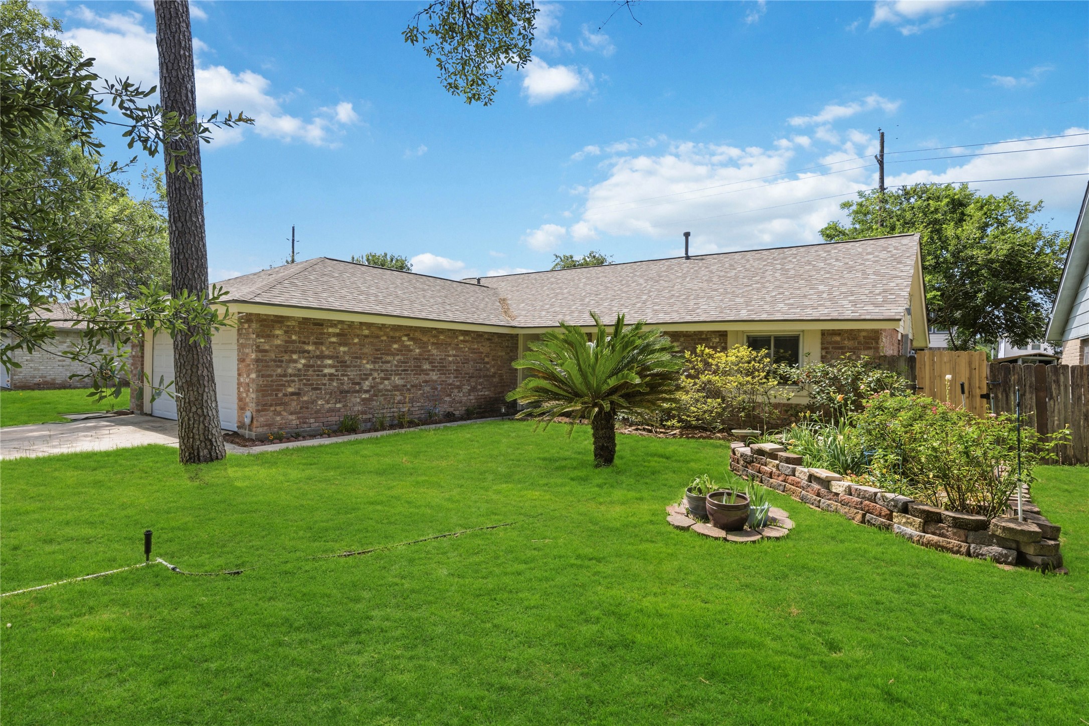 9635 Birsay Street Spring, TX 77379 - Photo 2 of 24 a view of a garden with a house