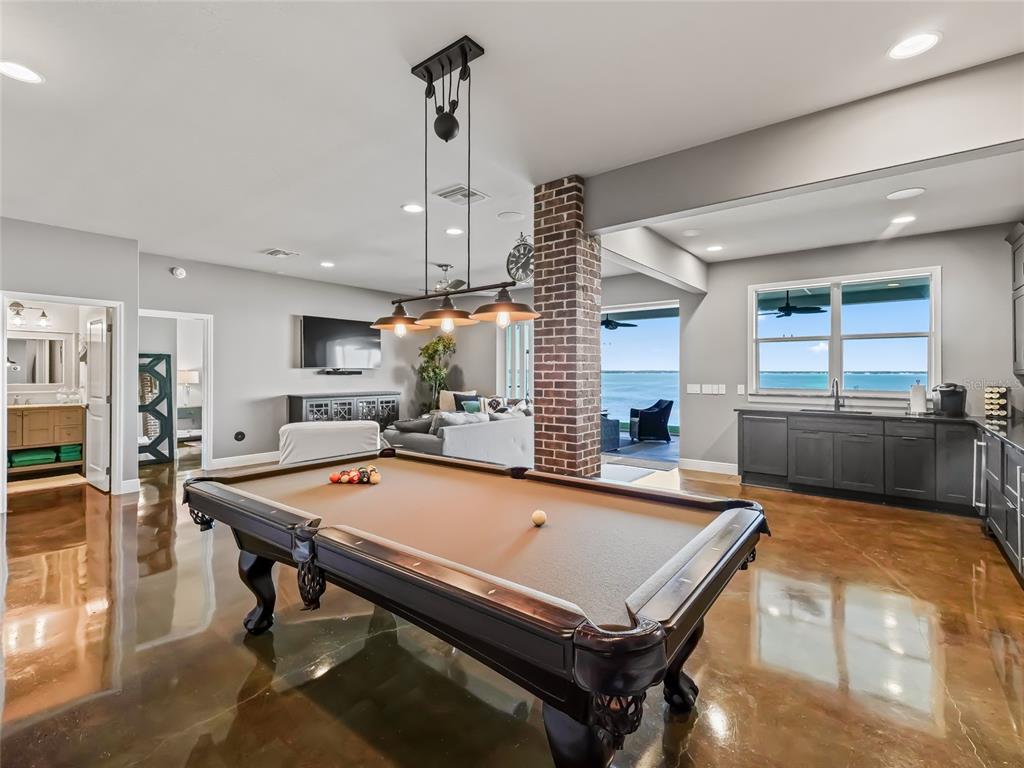 12943 Southeast Sunset Harbor Road Weirsdale, FL 32195 - Photo 62 of 87 a room with pool table and flat screen tv