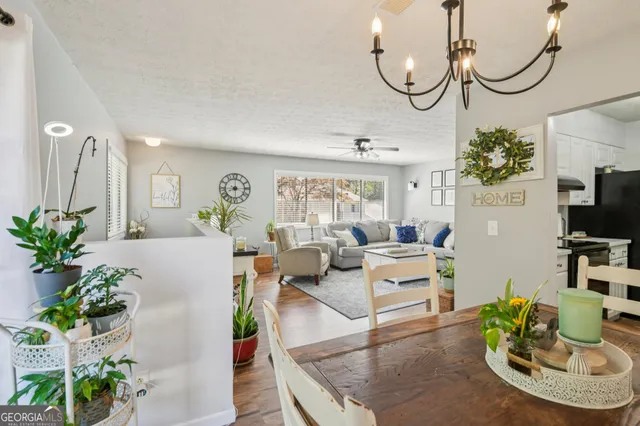a view of a dining room with furniture window and outside view