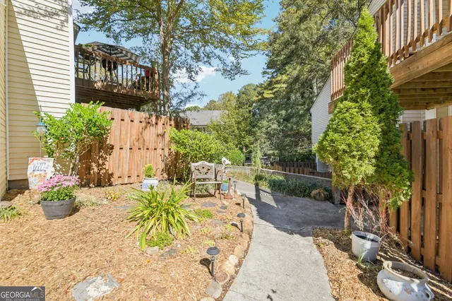 a view of a chairs and table in the patio