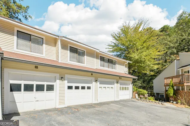 a view of a balcony with table and chairs