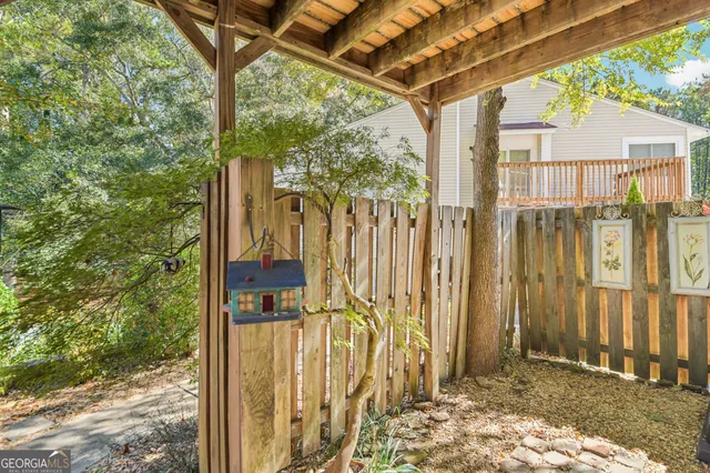 a view of a wooden door with a tree
