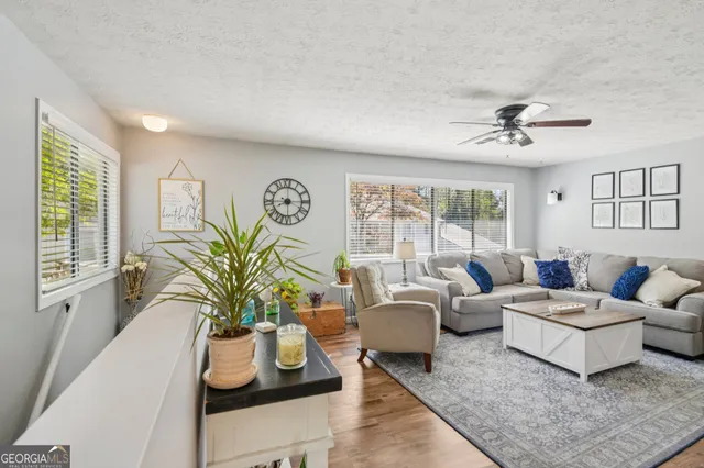 a living room with furniture and a large window