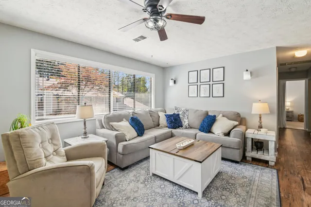 a living room with furniture and a window