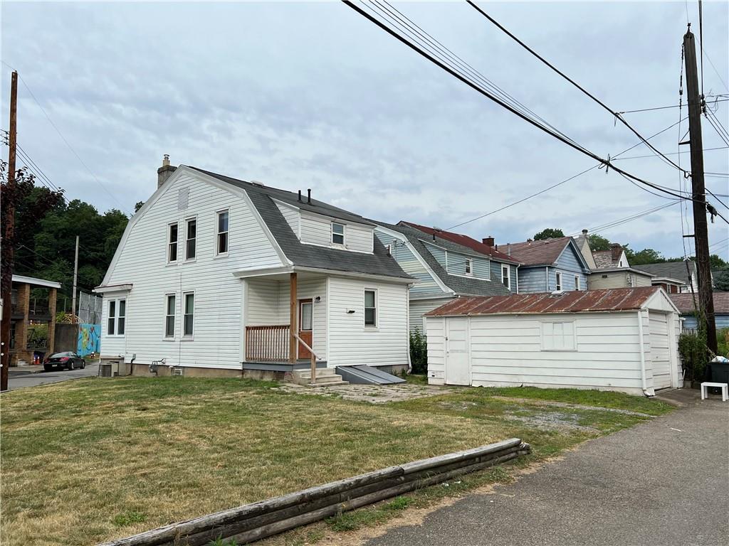 300 Grove Street McKees Rocks, PA 15136 - Photo 25 of 25 a front view of a house with a yard