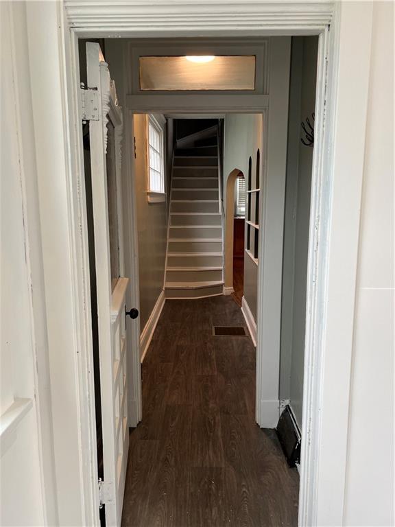 300 Grove Street McKees Rocks, PA 15136 - Photo 3 of 25 a view of hallway with stairs and wooden floor
