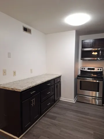 a kitchen with a stove and a microwave