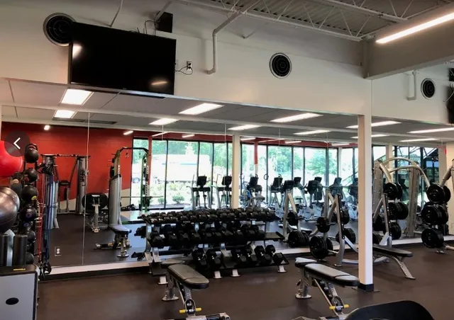 a room with gym equipment and a large window