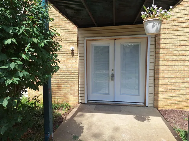 a view of a entryway door front of house
