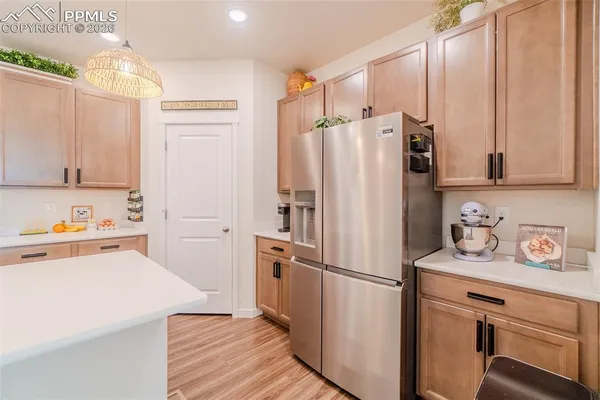 a white refrigerator freezer sitting in a kitchen