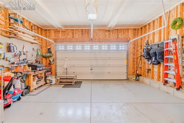 a view of a garage with storage