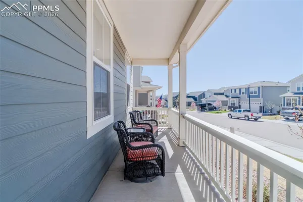 a view of balcony with furniture