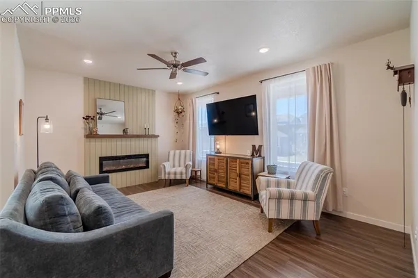 a living room with furniture and a fireplace