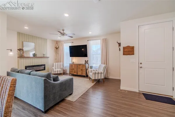 a living room with furniture and a flat screen tv