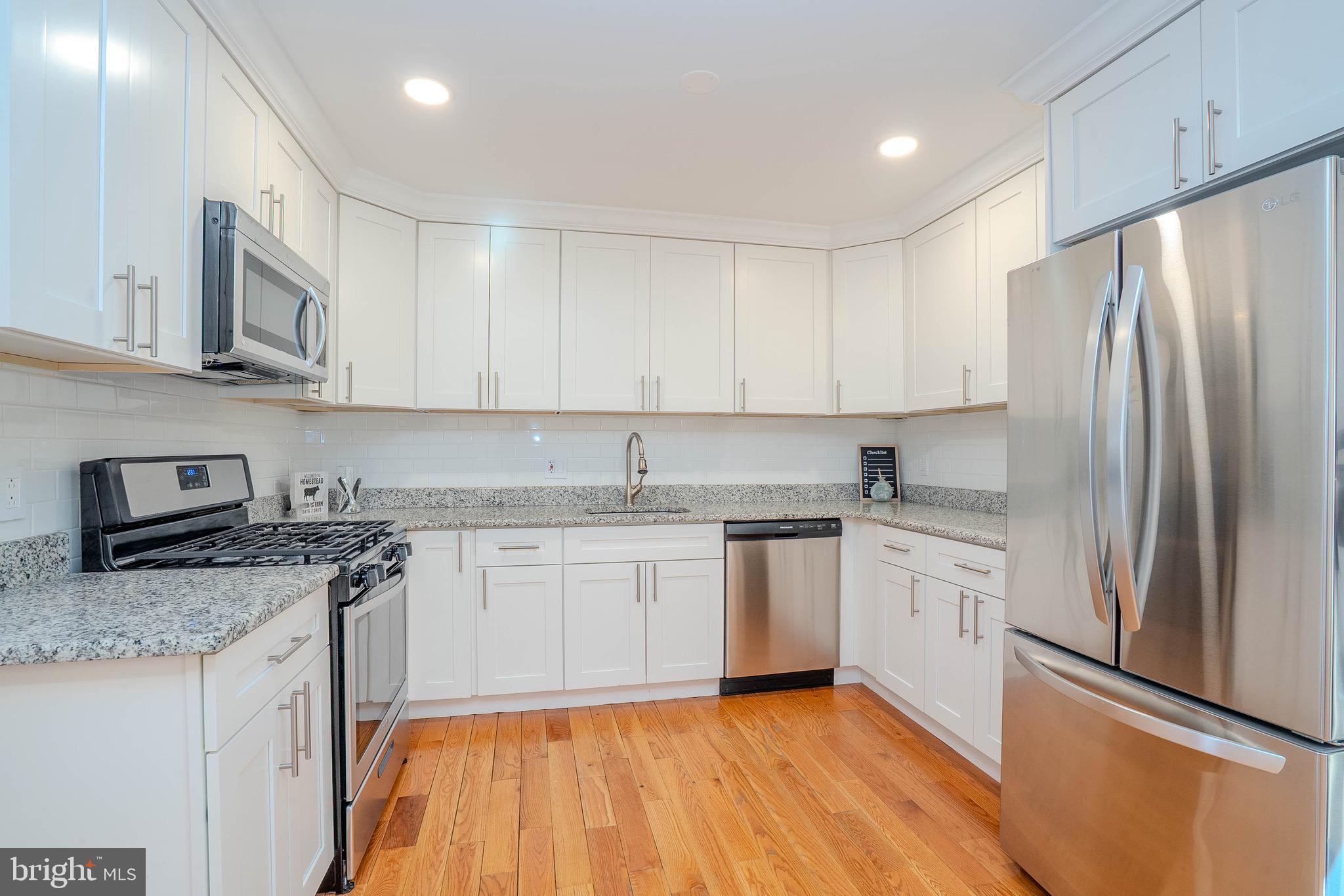 5 Balamor Lane Ewing, NJ 08628 - Photo 14 of 29 a kitchen with stainless steel appliances granite countertop a refrigerator sink and stove