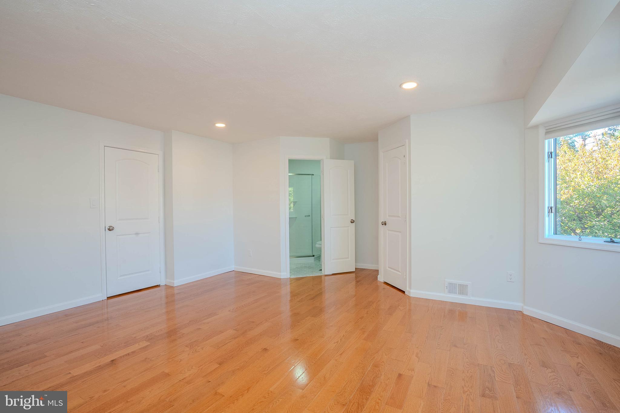 5 Balamor Lane Ewing, NJ 08628 - Photo 17 of 29 a view of an empty room with wooden floor and a window