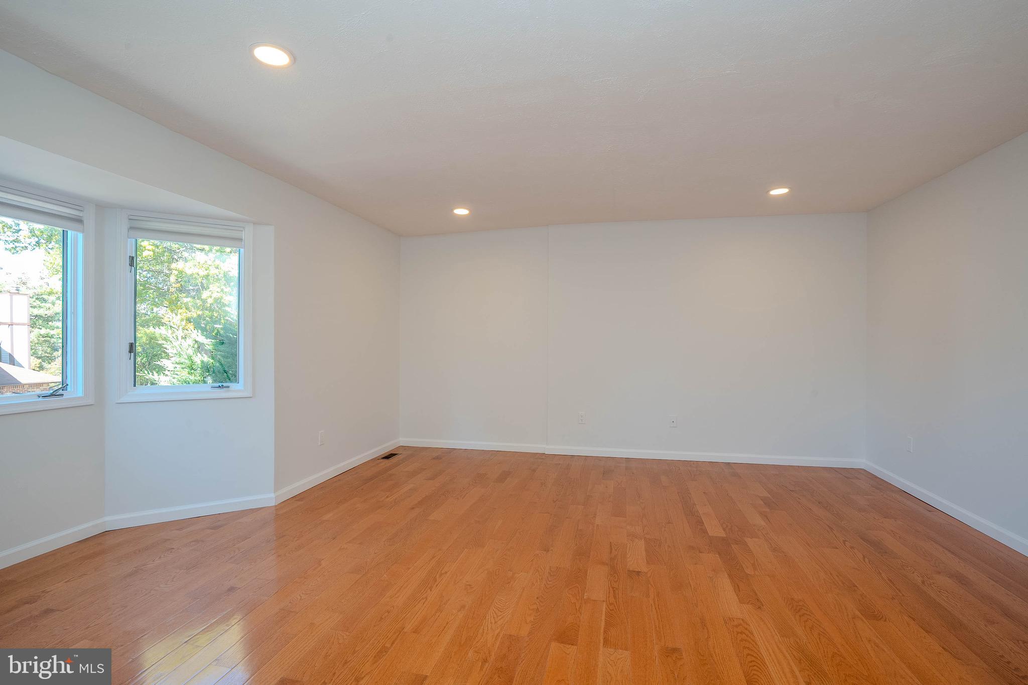 5 Balamor Lane Ewing, NJ 08628 - Photo 20 of 29 an empty room with wooden floor and windows