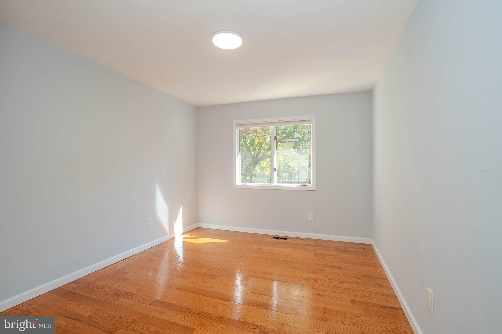 5 Balamor Lane Ewing, NJ 08628 - Photo 21 of 29 an empty room with wooden floor and windows