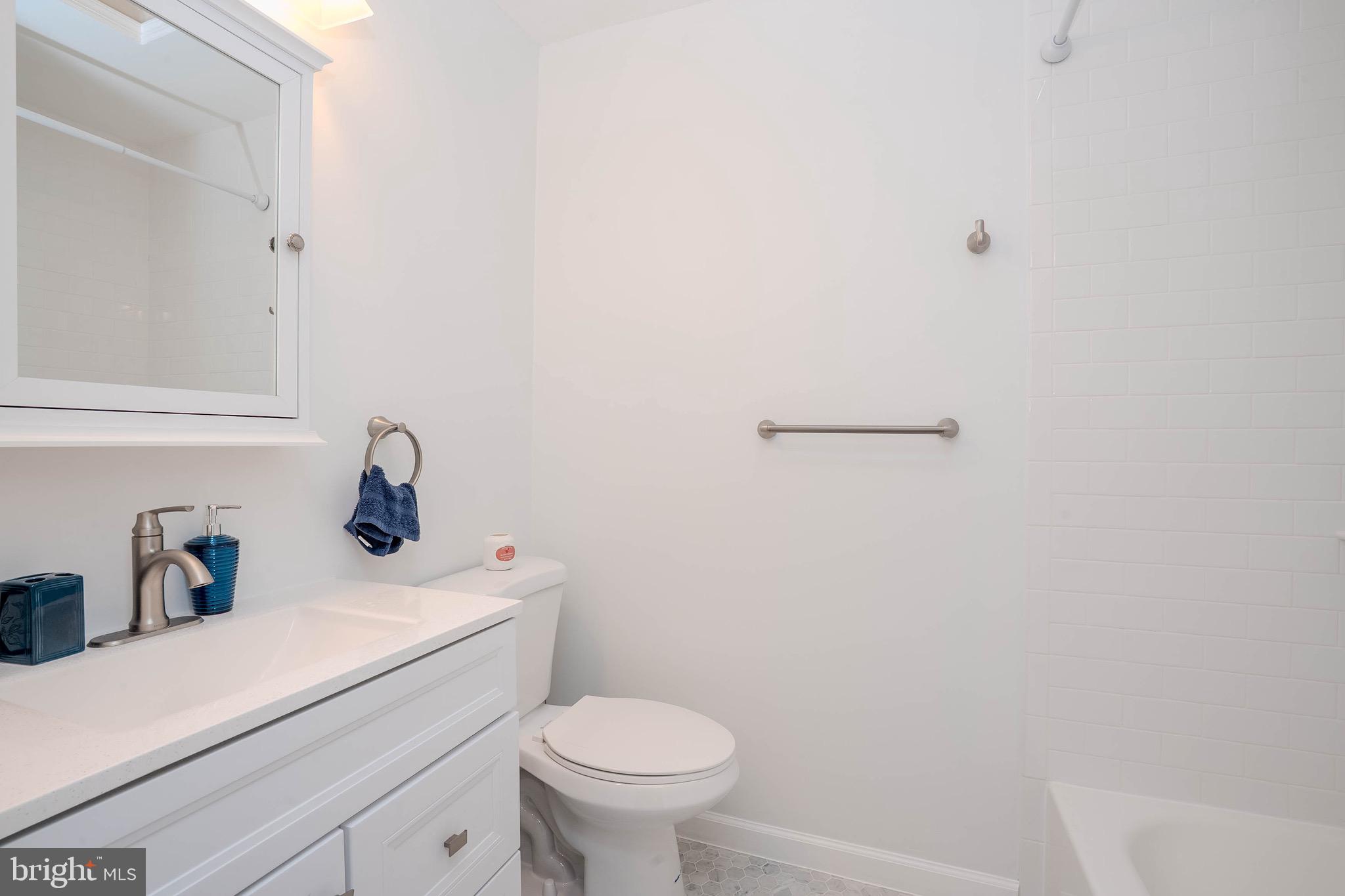 5 Balamor Lane Ewing, NJ 08628 - Photo 23 of 29 a bathroom with a sink a toilet and vanity