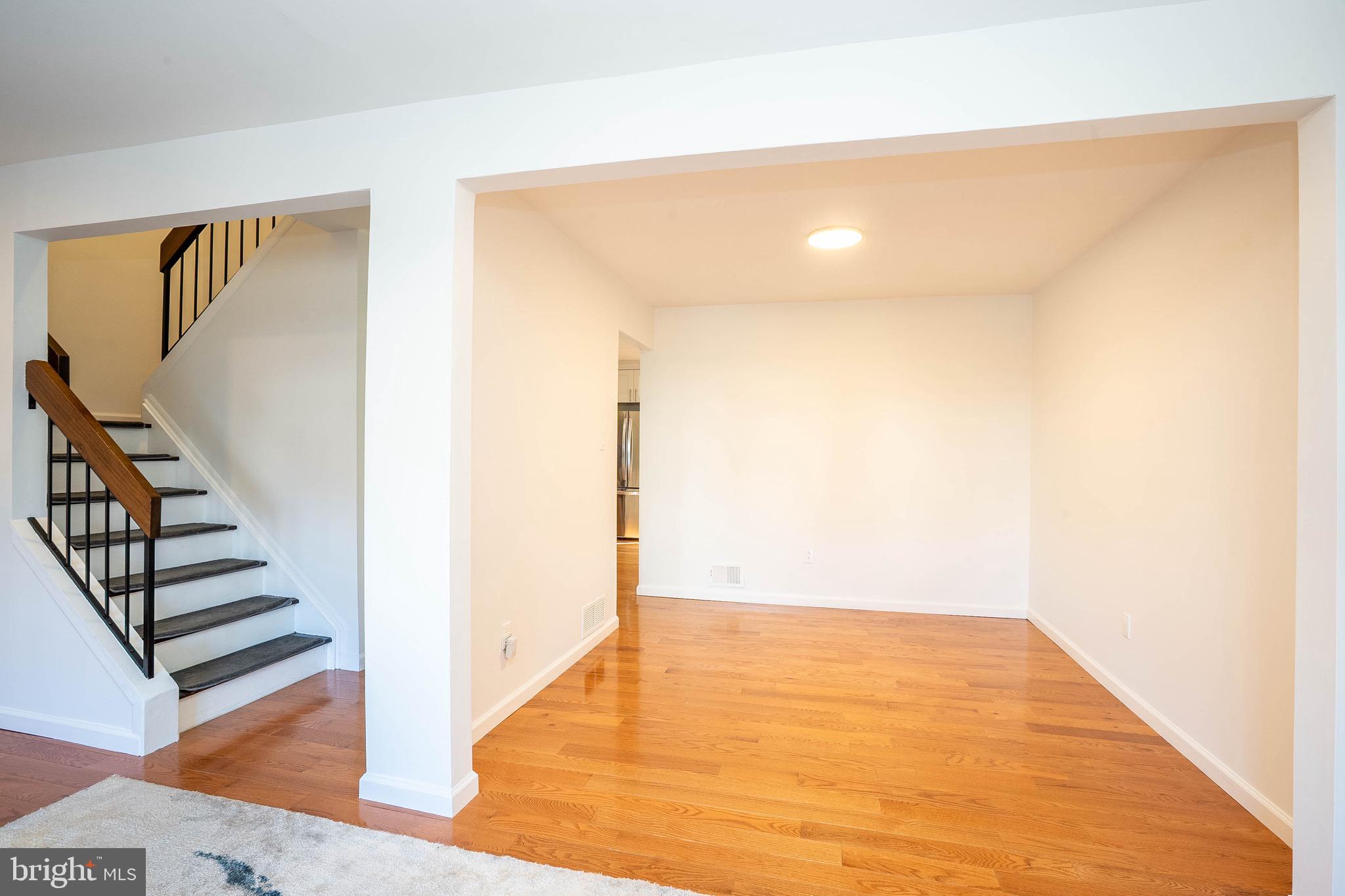 5 Balamor Lane Ewing, NJ 08628 - Photo 7 of 29 a view of an empty room with wooden floor and stairs
