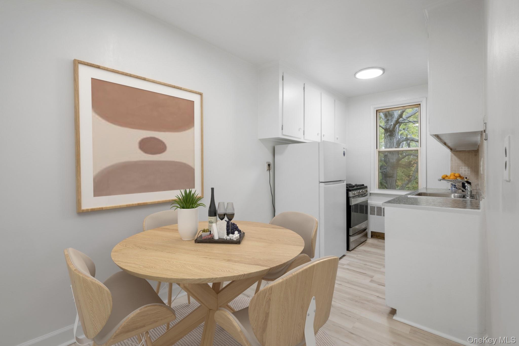 325 Palmer Terrace, Unit 2C Mamaroneck, NY 10543 - Photo 11 of 18 a view of a dining room with furniture and a potted plant