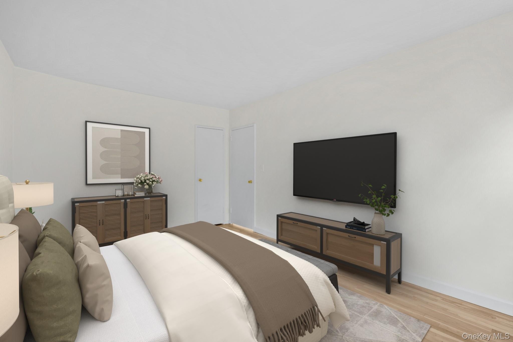 325 Palmer Terrace, Unit 2C Mamaroneck, NY 10543 - Photo 13 of 18 a bedroom with a bed and a flat screen tv